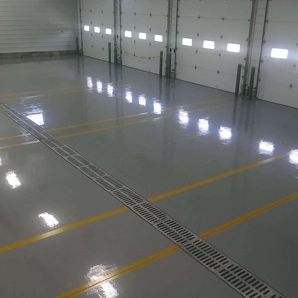 Beautiful yollow striped epoxy installed in a garage space